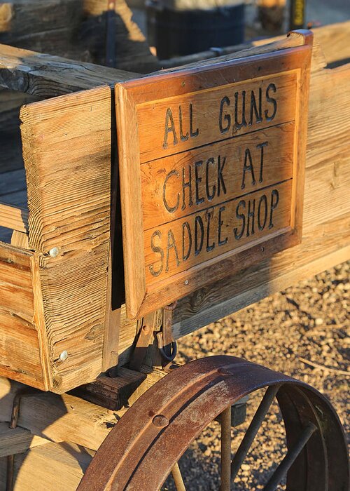 Guns Greeting Card featuring the photograph Check Guns at Saddle Shop by Michael Hope