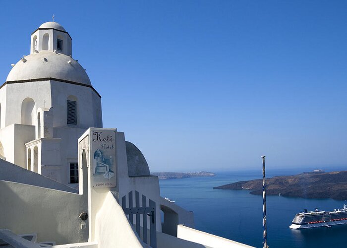 Santorini Greeting Card featuring the photograph Church watching over the ships by Brenda Kean
