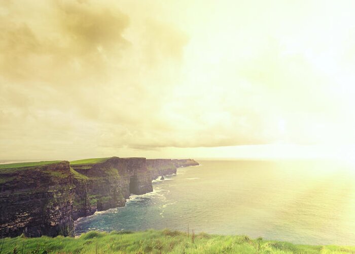 Scenics Greeting Card featuring the photograph Cliffs Of Moher At Sunset . Panoramic by Hoaru