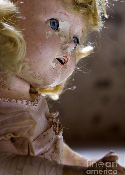 Antique; Broken; Childhood; Cracked; Dirty; Doll; Eerie; Eyes; Face; Gazing; Heirloom; Nostalgia; Old; Retro; Ruined; Scary; Staring; Toy; Vintage; Weird; Worn; Dark; Creepy; Female; Dress; Porcelain; Girl; Arm; Hair; Matted Greeting Card featuring the photograph Doll in the Attic by Margie Hurwich