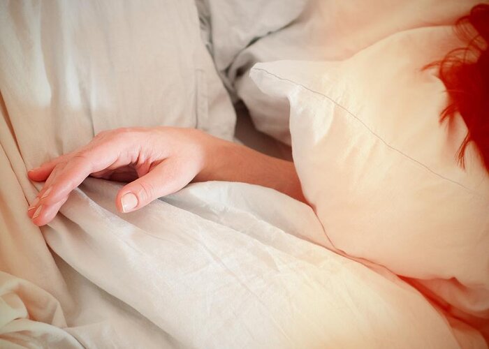 Morning Greeting Card featuring the photograph Early morning - pillows and hand of a woman by Matthias Hauser