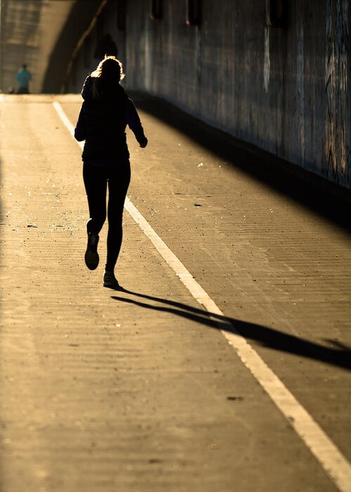Girl Greeting Card featuring the photograph Female Jogger In Backlight by Andreas Berthold
