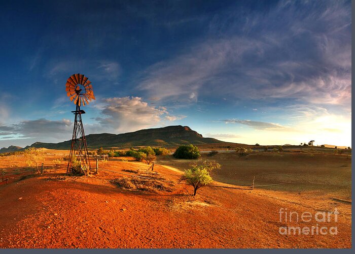 First Light Early Morning Windmill Dam Rawnsley Bluff Wilpena Pound Flinders Ranges South Australia Australian Landscape Landscapes Outback Red Earth Blue Sky Dry Arid Harsh Greeting Card featuring the photograph First Light on Wilpena Pound by Bill Robinson