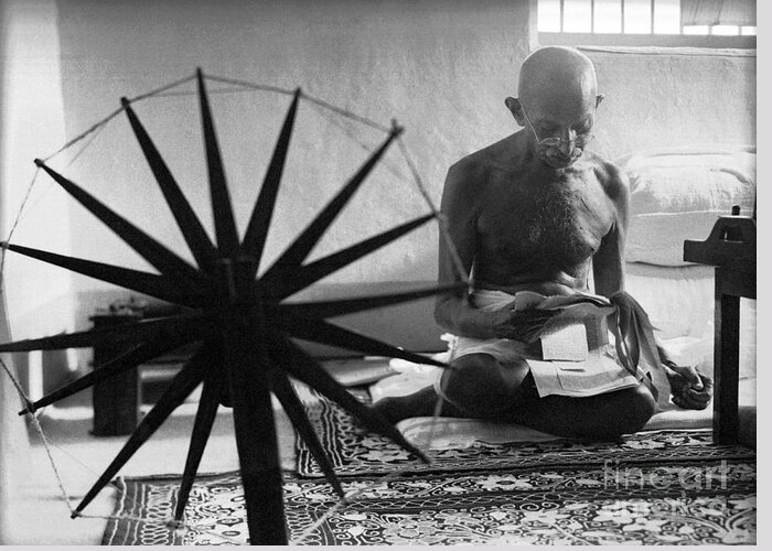 Gandhi At His Spinning Wheel Greeting Card featuring the photograph Gandhi at his Spinning Wheel by Celestial Images