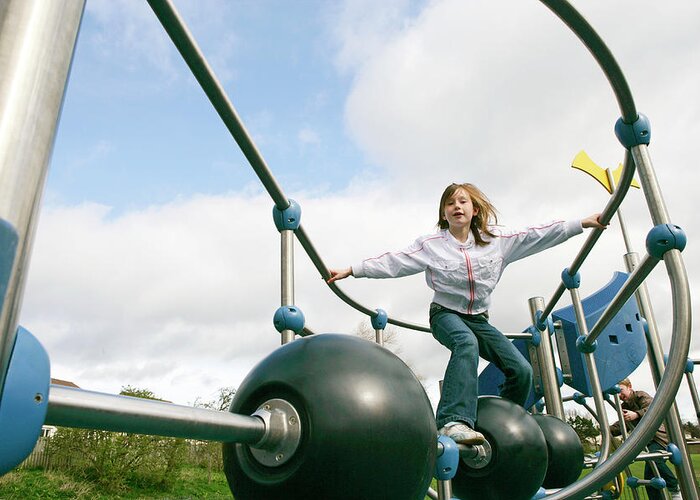 Climbing Frame Greeting Card featuring the photograph Girl Playing by Gustoimages/science Photo Library
