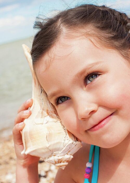 One Person Greeting Card featuring the photograph Girl With Seashell by Ian Hooton