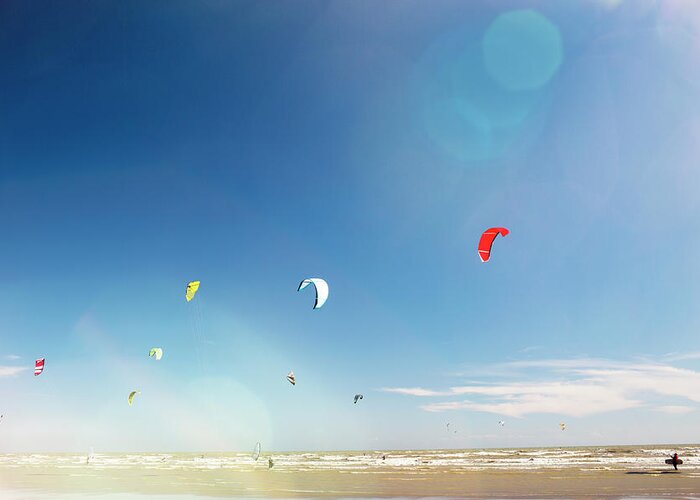 Water's Edge Greeting Card featuring the photograph Kite Surfers by Nick David