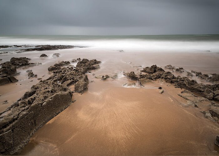 Landscape Greeting Card featuring the photograph Long exposure landscape beach scene with moody sky by Matthew Gibson