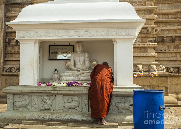 Robe Greeting Card featuring the photograph Monk praying at Ruwanwelisaya stupa in Sri Lanka by Patricia Hofmeester