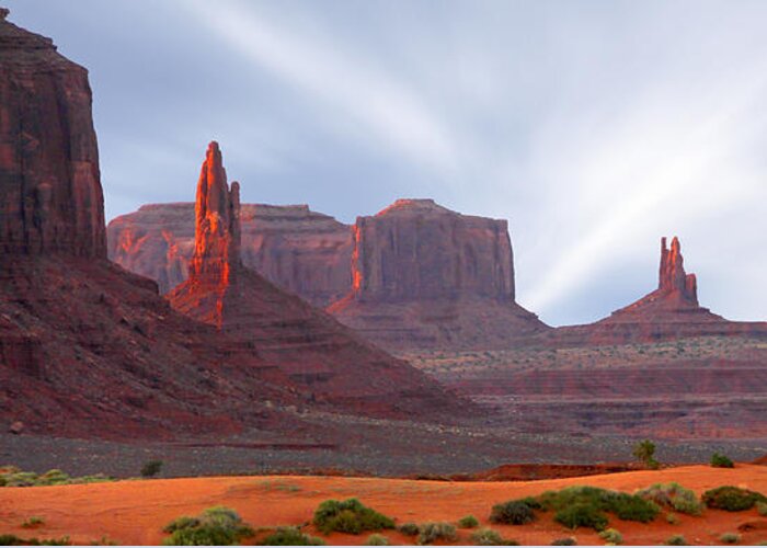 Desert Greeting Card featuring the photograph Monument Valley at Sunset Panoramic by Mike McGlothlen