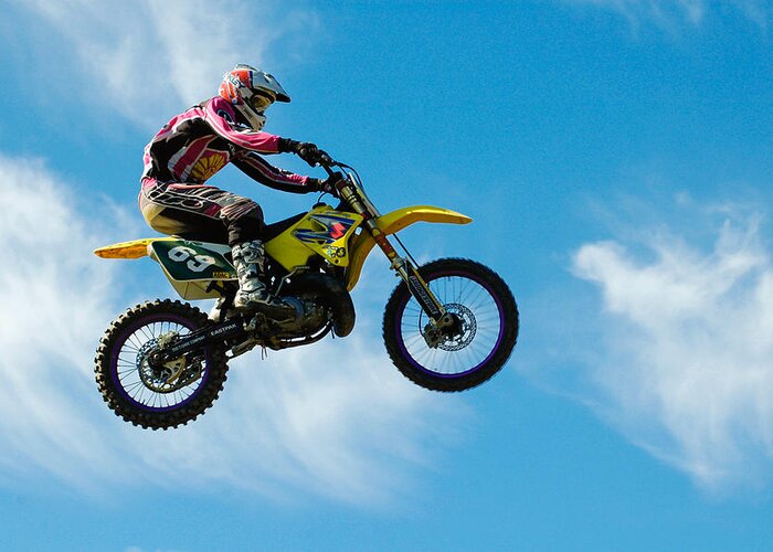 Motocross Greeting Card featuring the photograph Motocross rider jumping high - blue sky by Matthias Hauser