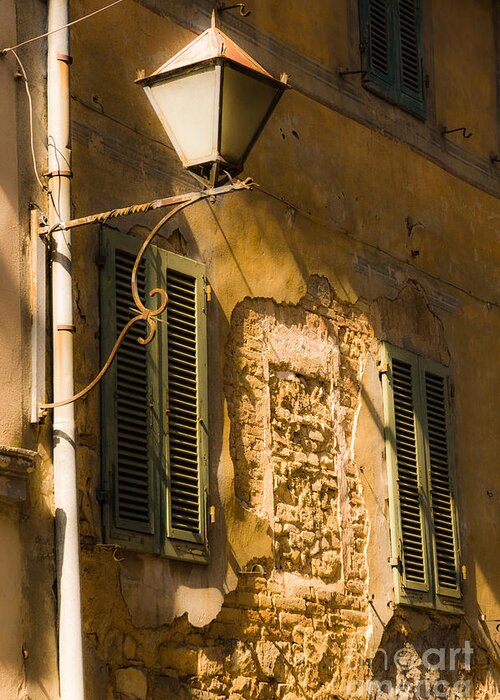 Europa Greeting Card featuring the photograph Old street lamp and shuttered windows in Montalcino by Peter Noyce