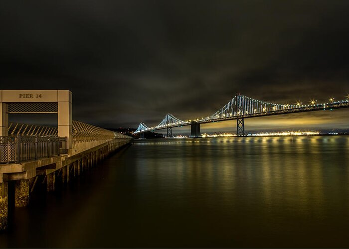 San Francisco Greeting Card featuring the photograph Pier 14 and Bay Bridge at Night by John Daly