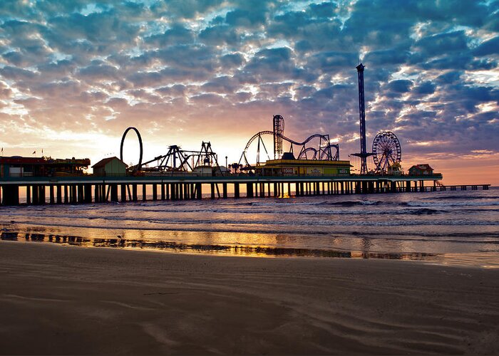 Pleasure Pier Greeting Card featuring the photograph Pleasure Pier Galveston at dawn by John Collins