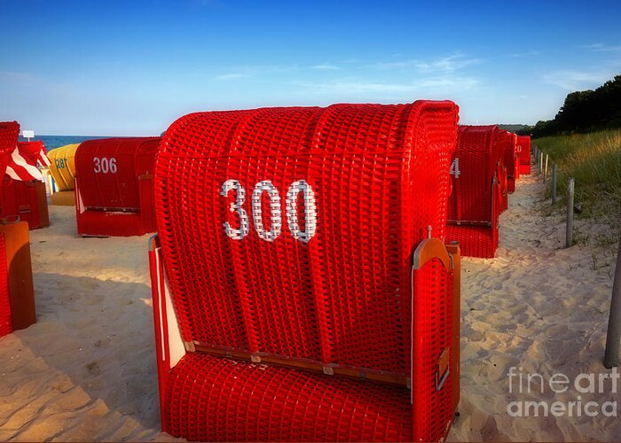 Beach Greeting Card featuring the photograph Red beach chairs in the early evening light by Nick Biemans
