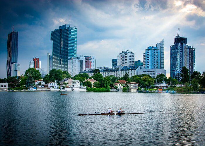 Skyline Greeting Card featuring the photograph Rowing Boat And The Skyline Of Vienna by Andreas Berthold