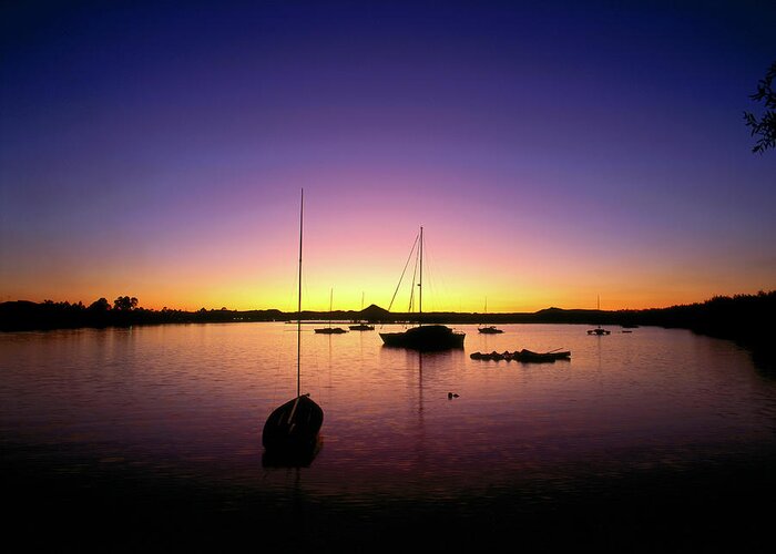 Tranquility Greeting Card featuring the photograph Ships In Harbour At Sunset by Richard I'anson