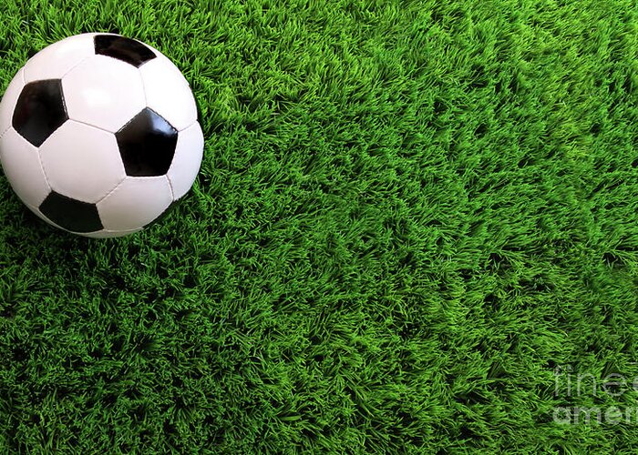 Ball Greeting Card featuring the photograph Soccer ball on green grass by Sandra Cunningham
