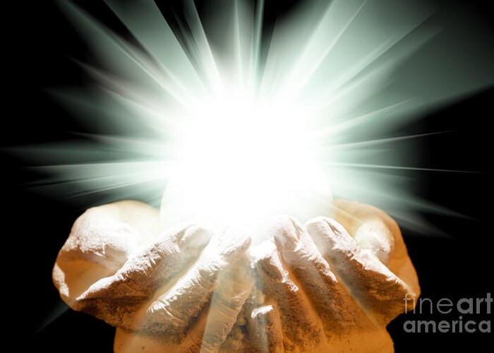 Spiritual Greeting Card featuring the photograph Spiritual light in cupped hands on a black background by Simon Bratt