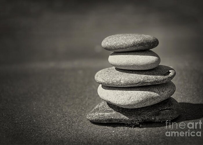 Rock Greeting Card featuring the photograph Stacked pebbles on beach by Elena Elisseeva