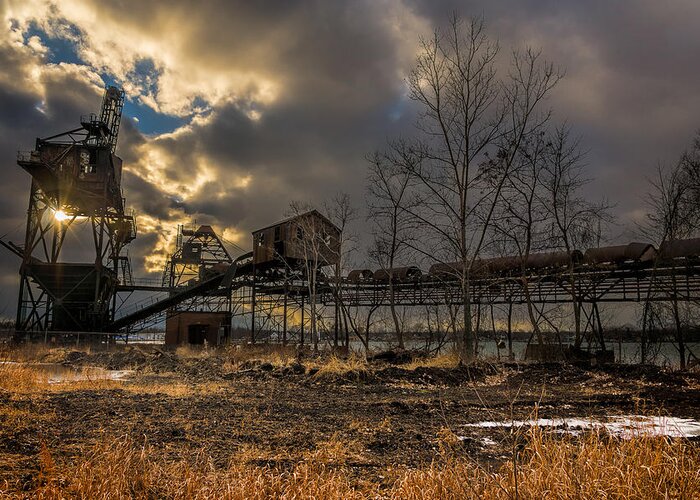 Belt Greeting Card featuring the photograph Sunlight through a Coal loader by Chris Bordeleau
