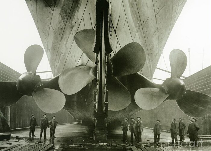 Engineering; Building; Shipyard; Disaster; Sea; Tragedy; Tragic; Transatlantic; Liner; Drydock; Dry Dock; Propeller Greeting Card featuring the photograph The Titanics propellers in the Thompson Graving Dock of Harland and Wolff by English Photographer