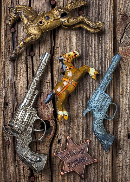 Toy Greeting Card featuring the photograph Toy guns and horses by Garry Gay