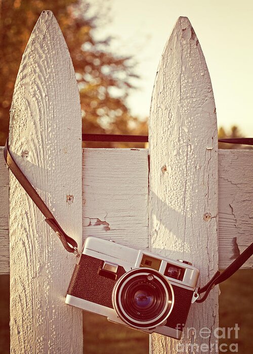 Sunrise Greeting Card featuring the photograph Vintage film camera on picket fence by Edward Fielding