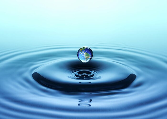 Water Surface Greeting Card featuring the photograph Water Drop With Reflection Of The Globe by Trout55