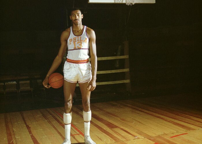 Marvin Newman Greeting Card featuring the photograph Wilt Chamberlain Stands Tall by Retro Images Archive