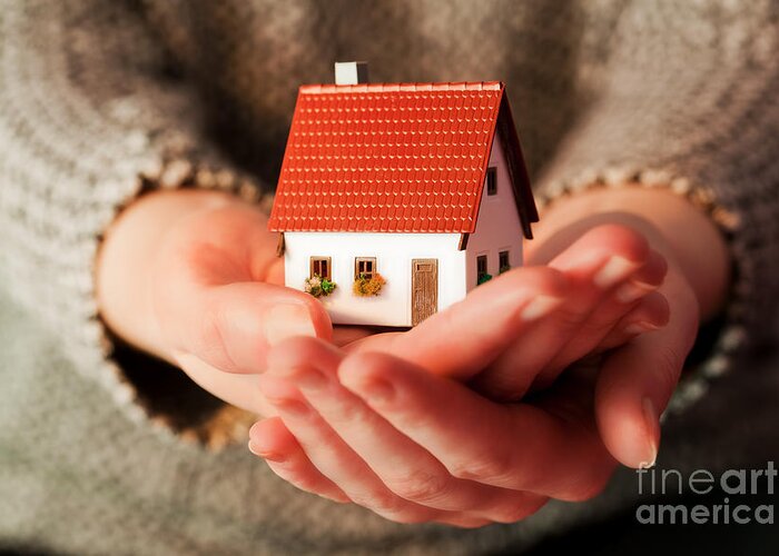 House Greeting Card featuring the photograph Woman holding a small new house in her hands by Michal Bednarek