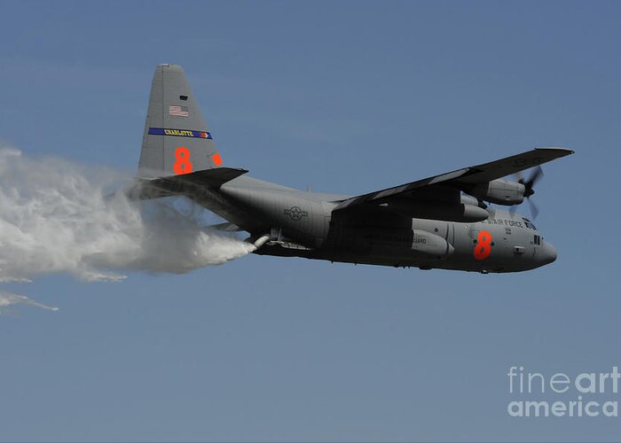 Modular Airborne Fire Fighting System Greeting Card featuring the photograph A U.s. Air Force C-130 Hercules by Stocktrek Images
