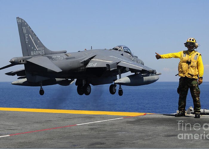 Uss Essex Greeting Card featuring the photograph Airman Gives The Thumbs-up Signal As An by Stocktrek Images
