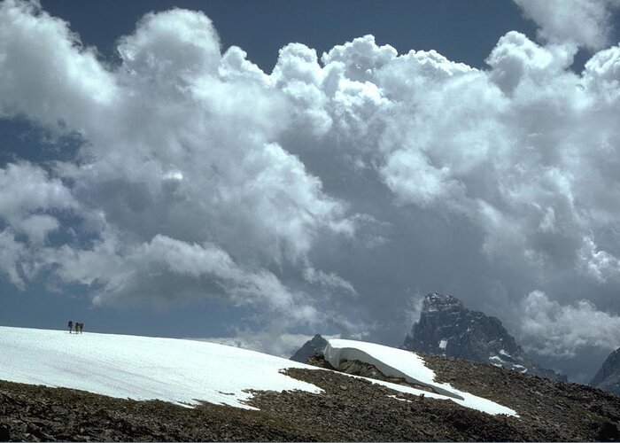Snow Field Hikers Teton Peak Dramatic Sky Greeting Card featuring the photograph Grand Teton by John Farley