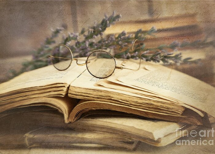 Ancient Greeting Card featuring the photograph Old books open on wooden table by Sandra Cunningham
