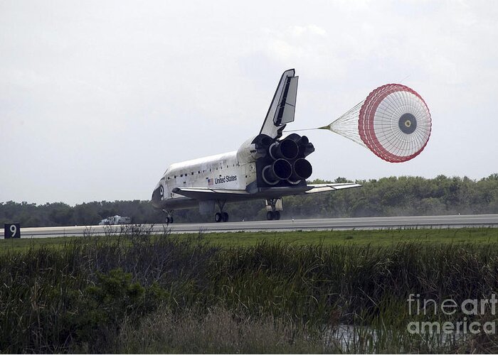 Tarmac Greeting Card featuring the photograph Space Shuttle Discoverys Drag Chute by Stocktrek Images