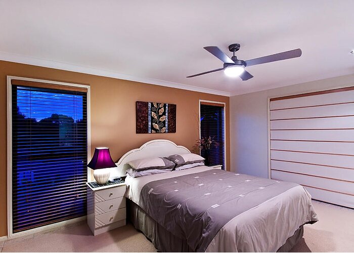 Evening Greeting Card featuring the photograph Master Bedroom At Twilight #1 by Darren Burton