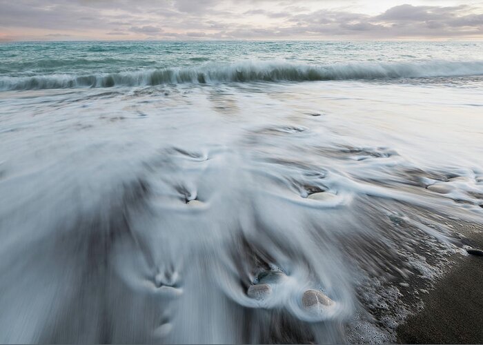 Coastline Greeting Card featuring the photograph Pebbles in the beach and flowing sea water by Michalakis Ppalis