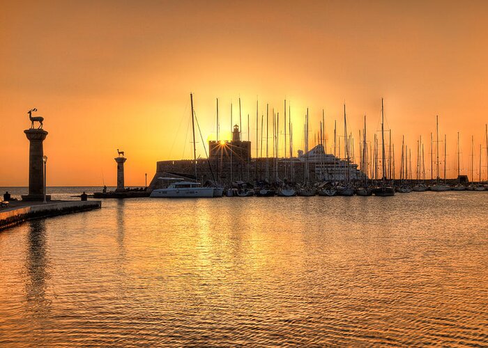 Aegean Greeting Card featuring the photograph The sunrise at the old port of Rhodes - Greece #1 by Constantinos Iliopoulos