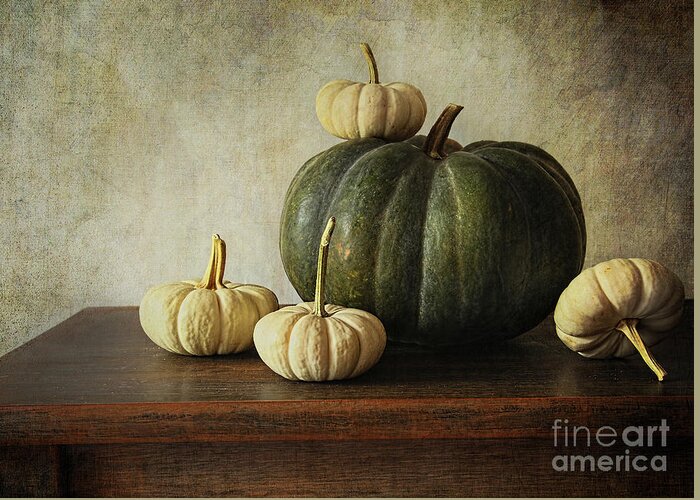 Agricultural Greeting Card featuring the photograph Green pumpkin and gourds on table #2 by Sandra Cunningham