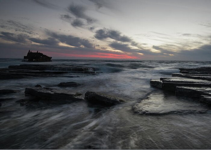 Seascape Greeting Card featuring the photograph Shipwreck of an abandoned ship on a rocky shore by Michalakis Ppalis