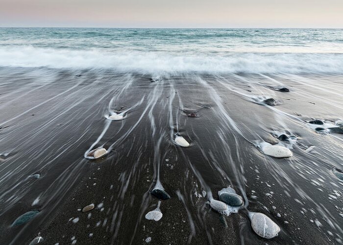 Seascape Greeting Card featuring the photograph Pebbles in the beach and flowing sea water by Michalakis Ppalis