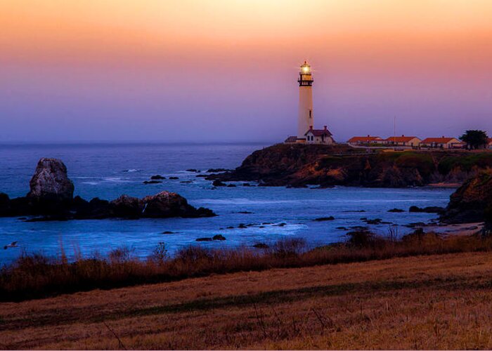 Lighthouse Greeting Card featuring the photograph A Light on a Rock by Janet Kopper