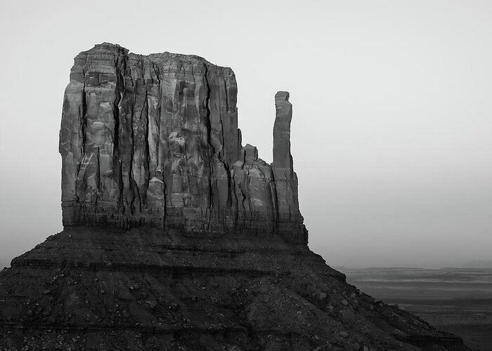 Monument Valley Greeting Card featuring the photograph A Monument of Stone Black and White by Gregory Ballos