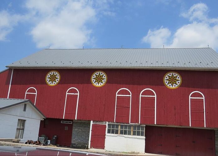 Red Barn Greeting Card featuring the photograph Barn with Hex Signs by Jeanette Oberholtzer