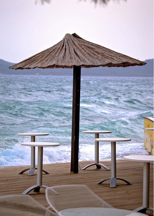 Beach Greeting Card featuring the photograph Beach bar parasol by rough sea by Brch Photography