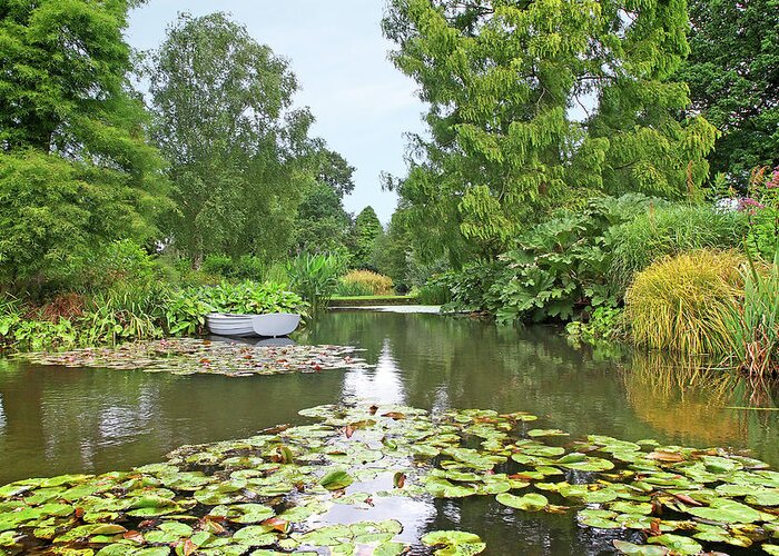 English Garden Greeting Card featuring the photograph Boat On The Lake by Gill Billington