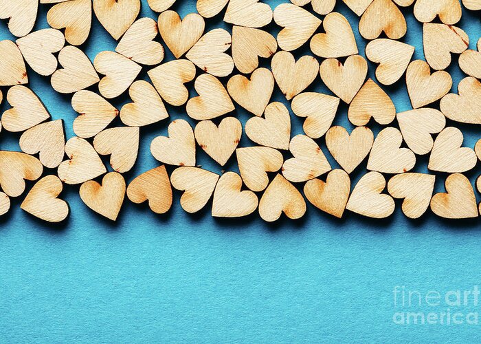Love Greeting Card featuring the photograph Bunch of hearts on blue background. by Michal Bednarek