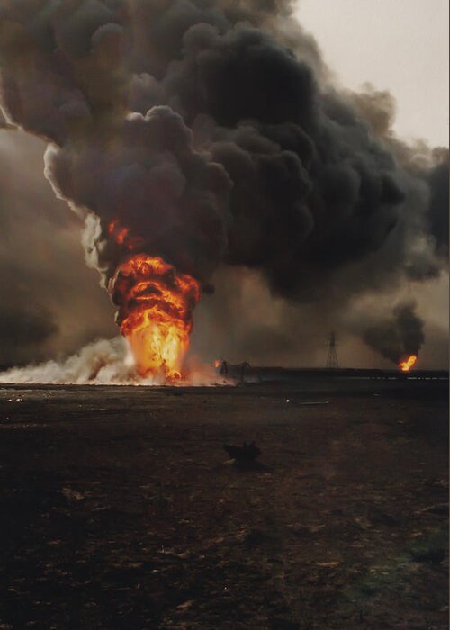 Aftermath Greeting Card featuring the photograph Burning oil well fires in field with oil slick, Kuwait by Karen Foley