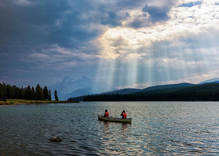 Alberta Canada Greeting Card featuring the photograph Canoeists on Maligne Lake by Dennis Kowalewski